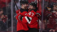 New Jersey Devils left wing Paul Cotter (47) celebrates his game winning goal with defenseman Dougie Hamilton (7) against the Boston Bruins during overtime at Prudential Center.