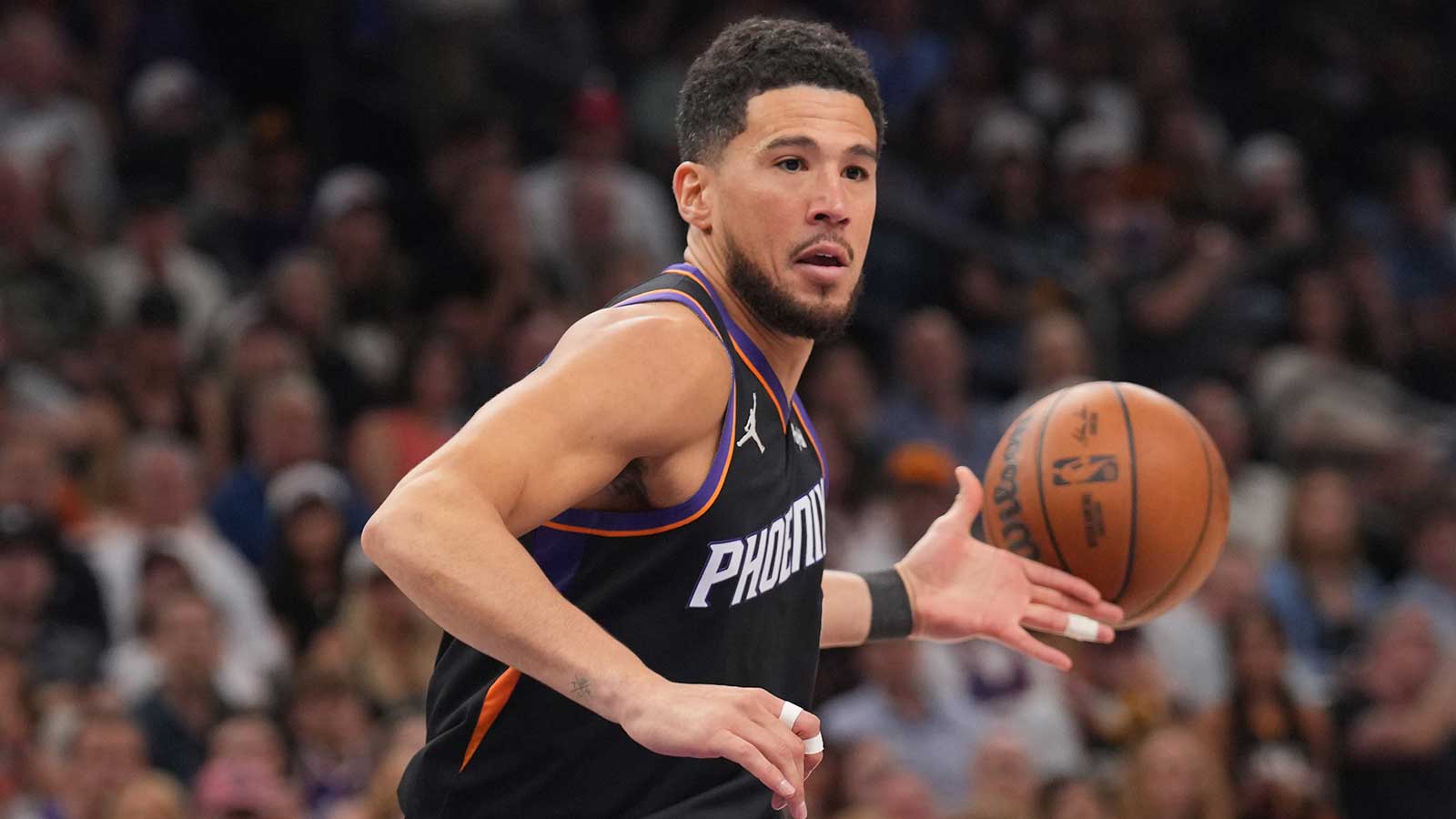 Phoenix Suns guard Devin Booker (1) loses control of the ball against the Milwaukee Bucks during the first half at Mortgage Matchup Center. 