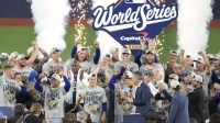 Nov 1, 2025; Toronto, Ontario, CAN; The Los Angeles Dodgers celebrate on the podium after defeating the Toronto Blue Jays in game seven of the 2025 MLB World Series at Rogers Centre. Mandatory Credit: Kevin Sousa-Imagn Images