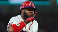 Dominican Republic first baseman Vladimir Guerrero Jr. (27) reacts after hitting a two-run home run against the Netherlands during the third inning at loanDepot Park.