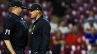 Pittsburgh Pirates manager Don Kelly (12) argues with umpire Jordan Baker (71) after being ejected in the eighth inning in the game against the Cincinnati Reds at Great American Ball Park.