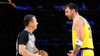 Los Angeles Lakers guard Luka Doncic (77) talks to a referee during the second half against the Denver Nuggets at Crypto.com Arena.