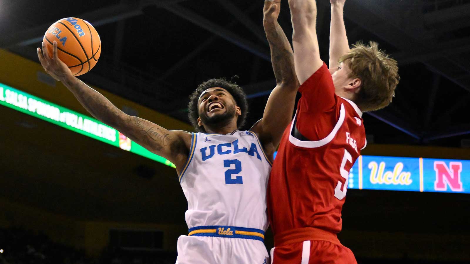 UCLA Bruins guard Donovan Dent (2) drives to the basket as Nebraska Cornhuskers forward Braden Frager (5) tries to defend during the first half at Pauley Pavilion presented by Wescom Financial.