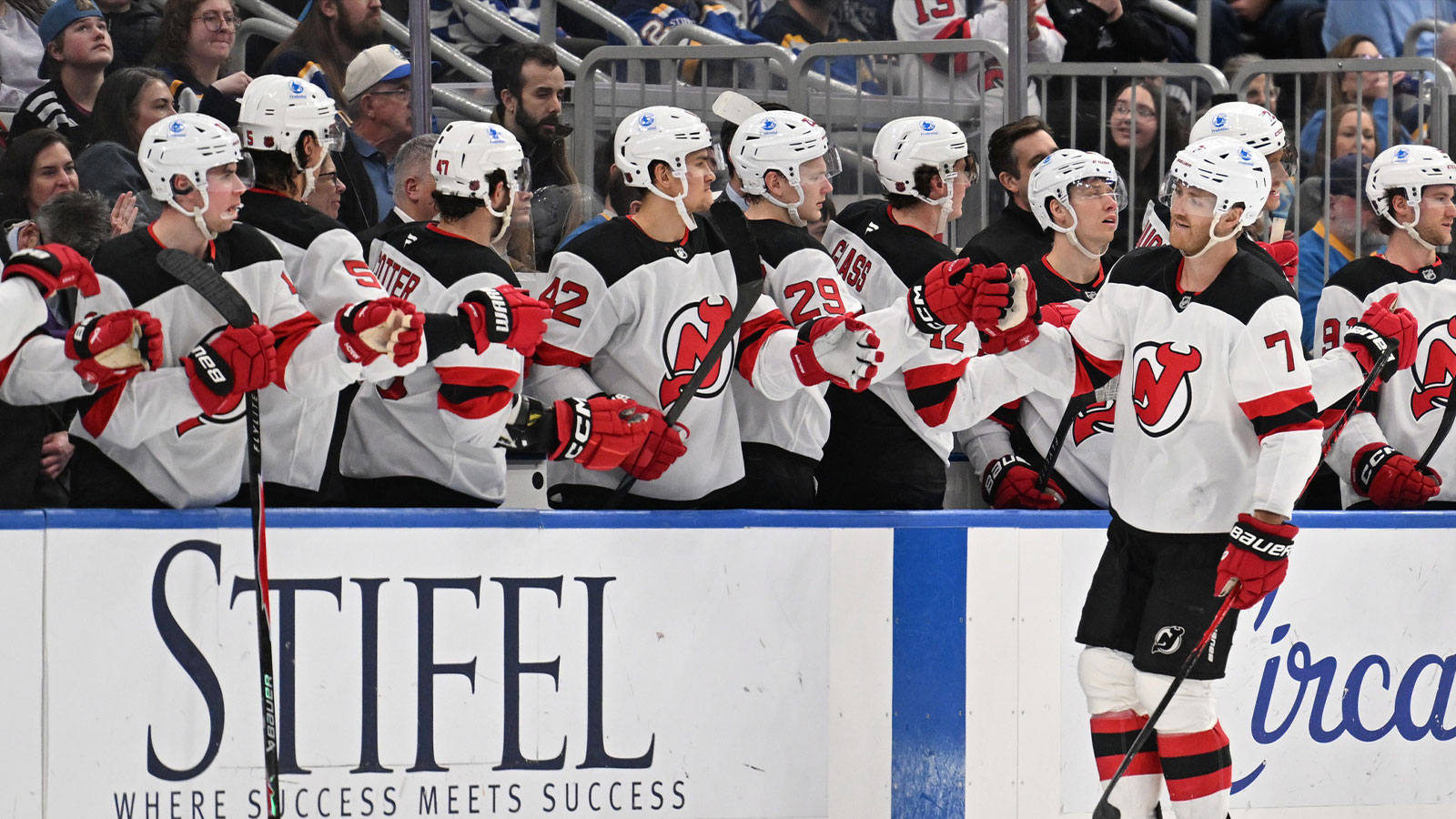 New Jersey Devils defenseman Dougie Hamilton (7) is congratulated by teammates after scoring a goal against the St. Louis Blues in the second period at Enterprise Center.