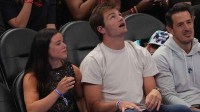 UNC grad and New England Patriot Drake Maye during the first quarter between the Charlotte Hornets and the New York Knicks at the Spectrum Center.