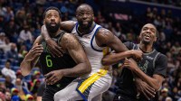 Golden State Warriors forward Draymond Green (23) fouls New Orleans Pelicans forward Herbert Jones (2) and center DeAndre Jordan (6) on a free throw attempt during the second half at Smoothie King Center.