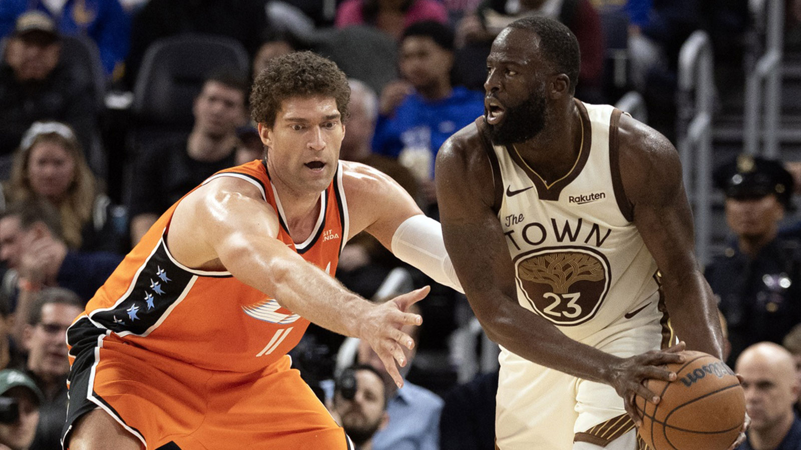 Golden State Warriors forward Draymond Green (23) looks to pass around Los Angeles Clippers center Brook Lopez (11) during the third quarter at Chase Center. 