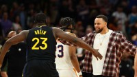 Golden State Warriors guard Stephen Curry celebrates with forward Draymond Green (23) against the Phoenix Suns in the second half at Mortgage Matchup Center.