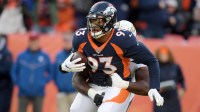 Dec 1, 2019; Denver, CO, USA; Denver Broncos defensive end Dre'Mont Jones (93) is pursued by Los Angeles Chargers offensive tackle Russell Okung (76) after intercepting a pass in the second quarter at Empower Field at Mile High. Mandatory Credit: Kirby Lee-Imagn Images