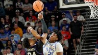 Duke Blue Devils center Patrick Ngongba (21) blocks the shot of TCU Horned Frogs forward Xavier Edmonds (24) March 21, 2026 during the second half of the NCAA Men’s Basketball Tournament second round East Region game at the Bon Secours Wellness Arena in Greenville, South Carolina.