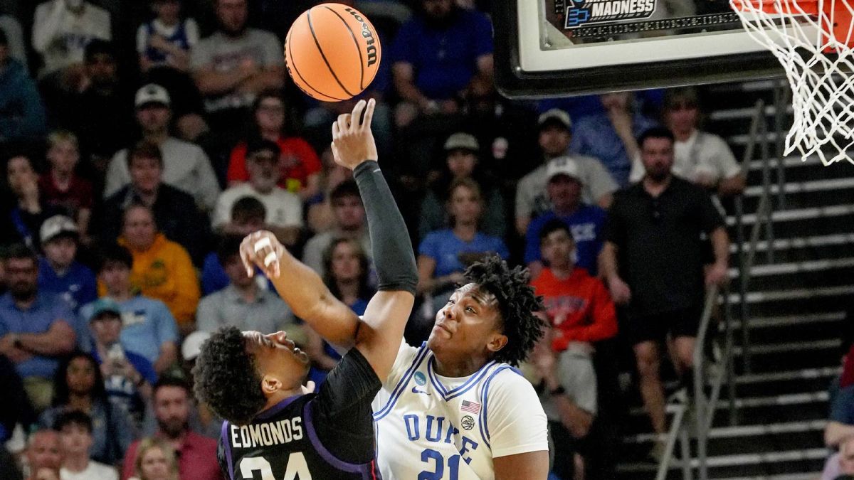 Duke Blue Devils center Patrick Ngongba (21) blocks the shot of TCU Horned Frogs forward Xavier Edmonds (24) March 21, 2026 during the second half of the NCAA Men’s Basketball Tournament second round East Region game at the Bon Secours Wellness Arena in Greenville, South Carolina.