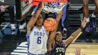 Duke Blue Devils forward Maliq Brown (6) dunks near TCU Horned Frogs guard Jayden Pierre (1) March 21, 2026 during the second half of the NCAA Men’s Basketball Tournament second round East Region game at the Bon Secours Wellness Arena in Greenville, South Carolina.