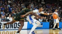 Duke Blue Devils guard Isaiah Evans (3) dribbles the ball against the Siena Saints in the second half during a first round game of the men's 2026 NCAA Tournament at Bon Secours Wellness Arena.