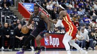 Detroit Pistons center Jalen Duren (0) dribbles defended by Atlanta Hawks forward Onyeka Okongwu (17) in the first half at Little Caesars Arena