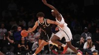 McDonald's All American East forward Cameron Boozer (12) dribbles the ball against McDonald's All American West forward AJ Dybantsa (3) during the second half of the game at Barclays Center.
