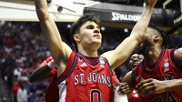 St. John's Red Storm guard Dylan Darling (0) celebrates after defeating the Kansas Jayhawks in a second round game of the men's 2026 NCAA Tournament at Viejas Arena.
