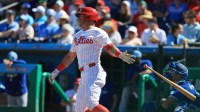 Philadelphia Phillies first baseman Dylan Moore (25) singles during the sixth inning against the Toronto Blue Jays at BayCare Ballpark.