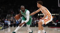 Boston Celtics guard Jaylen Brown (7) dribbles against Atlanta Hawks guard Dyson Daniels (5) in the first half at State Farm Arena.