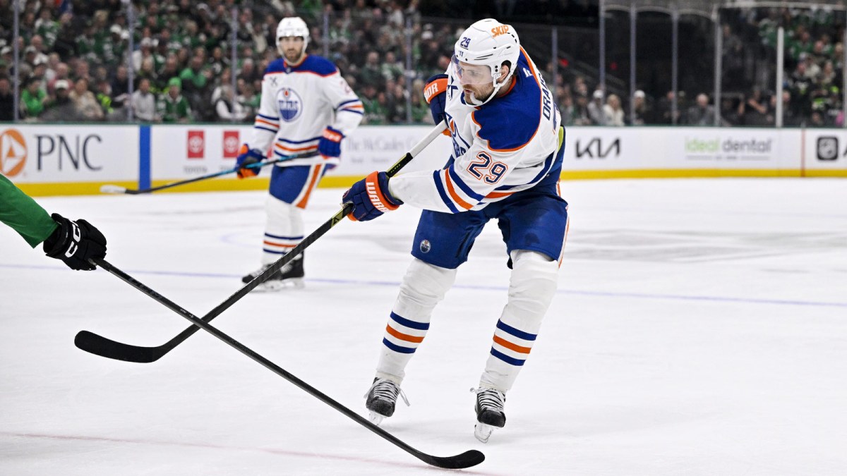 Edmonton Oilers center Leon Draisaitl (29) passes the puck during the game between the Stars and the Oilers at the American Airlines Center.