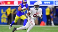 Arizona Cardinals running back Emari Demercado (31) runs after the catch against the Los Angeles Rams during the second half at SoFi Stadium.