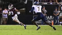Mississippi State Bulldogs wide receiver Kevin Coleman Jr. (3) runs the ball against Toledo Rockets safety Emmanuel McNeil-Warren (7) during the second quarter at Davis Wade Stadium at Scott Field.