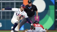 United States second baseman Ernie Clement (5) catches Great Britain third baseman Nate Eaton (18) stealing second base during the sixth inning at Daikin Park.