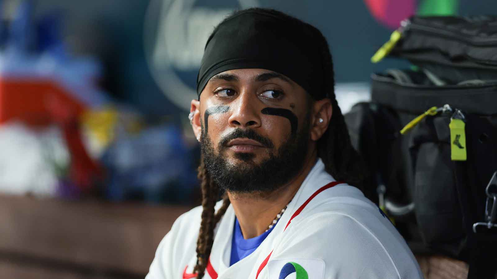 Dominican Republic right fielder Fernando Tatis Jr. (23) looks on from inside the dugout against the Netherlands during the sixth inning at loanDepot Park.