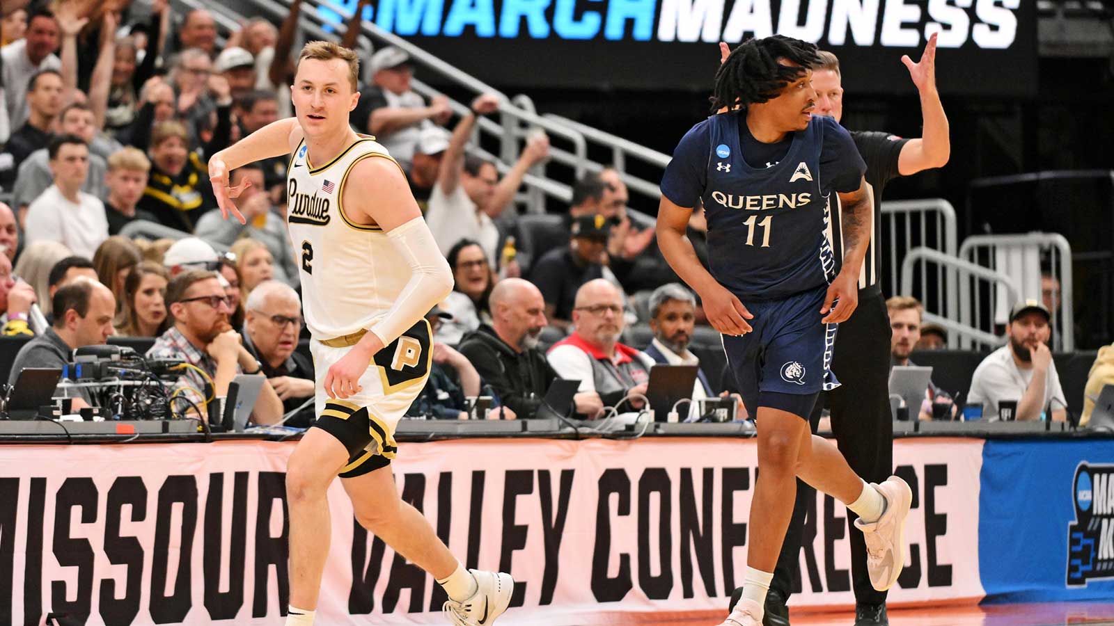 Purdue Boilermakers guard Fletcher Loyer (2) reacts after shooting a basket during the second half against Queens University of Charlotte Royals guard Chris Ashby (11) during a first round game of the men's 2026 NCAA Tournament at Enterprise Center.