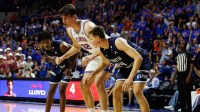 North Florida Ospreys guard Dante Oliver (5) and North Florida Ospreys forward Nestor Dyachok (24) attempt to box out Florida Gators center Olivier Rioux (32) during the second half at Exactech Arena at the Stephen C. O'Connell Center.