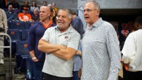 Former Auburn Tigers basketball coach Bruce Pearl and football coach Gus Malzahn talk before the game as Auburn Tigers take on LSU Tigers at Neville Arena in Auburn, Ala. on Tuesday, March 3, 2026.