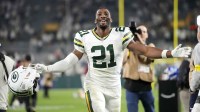 Green Bay Packers cornerback Nate Hobbs (21) celebrates after defeating the Washington Commanders at Lambeau Field.
