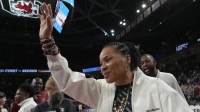 South Carolina Coach Dawn Staley waves to fans Monday, March 23, 2026, after the Gamecocks won in the NCAA Women's Basketball Tournament at Colonial Life Arena in Columbia, South Carolina.
