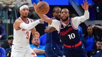 Los Angeles Clippers guard Darius Garland (10) moves in for the ball as New York Knicks guard Josh Hart (3) passes during the second half at Intuit Dome.