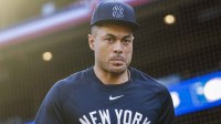 New York Yankees designated hitter Giancarlo Stanton (27) exits the clubhouse during batting practice against the Seattle Mariners at T-Mobile Park.