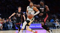 Milwaukee Bucks forward Giannis Antetokounmpo (34) drives to the basket against Miami Heat center Bam Adebayo (13) during the first quarter at Kaseya Center.