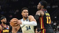 ; Milwaukee Bucks forward Giannis Antetokounmpo (34) drives for the basket against Atlanta Hawks center Onyeka Okongwu (17) in the first quarter at Fiserv Forum.
