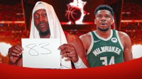 Heat's Bam Adebayo with "83" paper next to Giannis Antetokounmpo