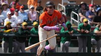 San Francisco Giants left fielder Harrison Bader (9) hits a single against the Athletics in the third inning at Scottsdale Stadium.