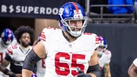 New York Giants guard Austin Schlottmann (65) runs out the tunnel against New Orleans Saints during warmups at Caesars Superdome.