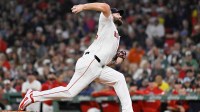 Boston Red Sox starting pitcher Lucas Giolito (54) pitches against the Athletics during the third inning at Fenway Park.