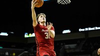 Wisconsin Badgers forward Nolan Winter (31) scores during the second half against the Oregon Ducks at Matthew Knight Arena.