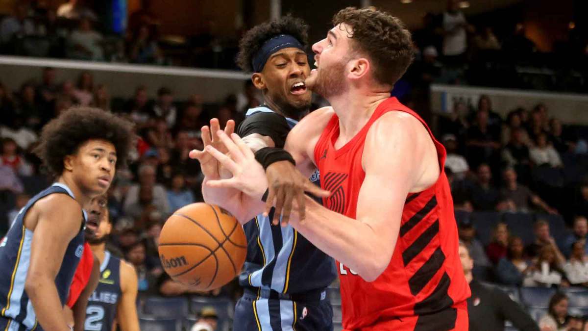 Memphis Grizzlies forward Olivier-Maxence Prosper (18) knocks the ball loose from Portland Trail Blazers center Donovan Clingan (23) during the first quarter at FedExForum. Mandatory Credit: Petre Thomas-Imagn Images