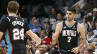 Memphis Grizzlies forward Santi Aldama (7) reacts with guard Cam Spencer (24) during the second quarter against the Oklahoma City Thunder at FedExForum.
