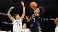 Notre Dame Fighting Irish guard Hannah Hidalgo (3) scores a basket against Vanderbilt Commodores forward Sacha Washington (35) during the first half at Dickies Arena.