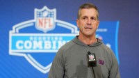 New York Giants coach John Harbaugh speaks at the NFL Scouting Combine at the Indiana Convention Center