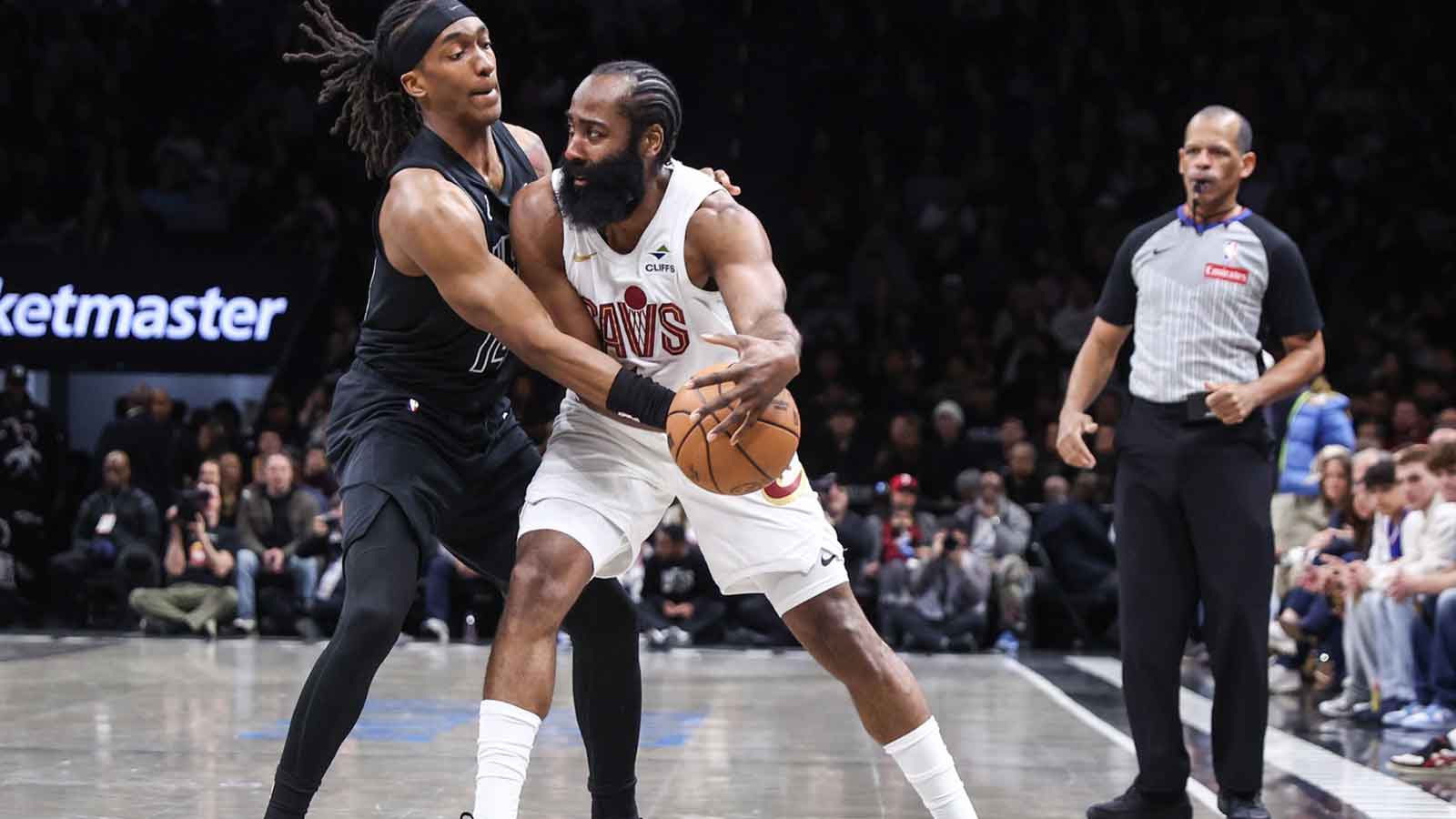 Cleveland Cavaliers guard James Harden (1) looks to drive past Brooklyn Nets guard Terance Mann (14) in the first quarter at Barclays Center.