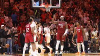 Heat center Bam Adebayo (13) reacts after becoming