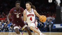 Houston Cougars guard Kingston Flemings (4) drives to the hoop past Texas A&M Aggies guard Ali Dibba (6) during the second half of a second round game of the men's 2026 NCAA Tournament at Paycom Center.