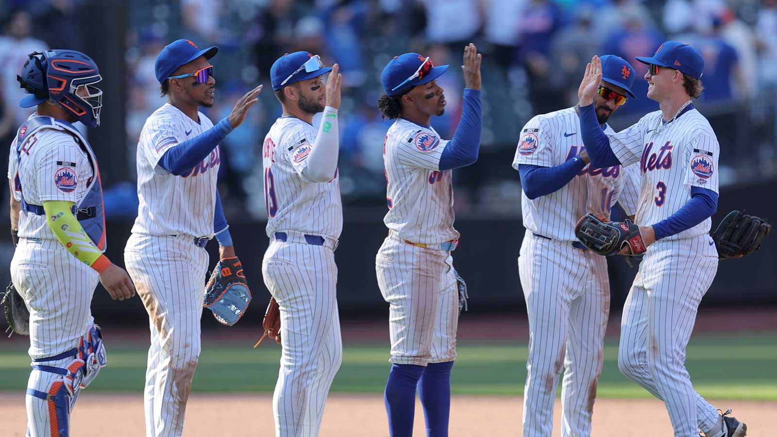 New York Mets right fielder Carson Benge (3) celebrates with second baseman Marcus Semien (10) and shortstop Francisco Lindor (12) and third baseman Bo Bichette (19) and first baseman Jorge Polanco (11) and catcher Francisco Alvarez (4) after defeating the Pittsburgh Pirates at Citi Field. Mandatory Credit: Brad Penner-Imagn Images
