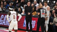 Cleveland Cavaliers head coach Kenny Atkinson argues with an official during their game against the Detroit Pistons in the first half at Little Caesars Arena.